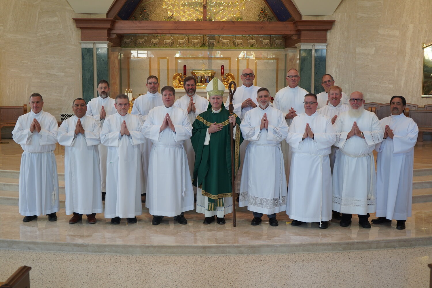 Fifteen candidates for the Permanent Diaconate — (First row) Michael Dorrell, Osmaro DeLeon, Robert Czarnecki, Kenneth Arthur, Edward Galbraith, Dwayne Goodwin, James Rangitsch Jr., Charles Ochoa, (second row, far right) Brian Lutz, (third row) Harvey Million Jr., Chad Freie, Louie Delk, Denis Gladbach, Keith Henke and Mark Oligschlaeger — join Bishop W. Shawn McKnight in the sanctuary of the Cathedral of St. Joseph Nov. 5 after he instituted them as lectors.